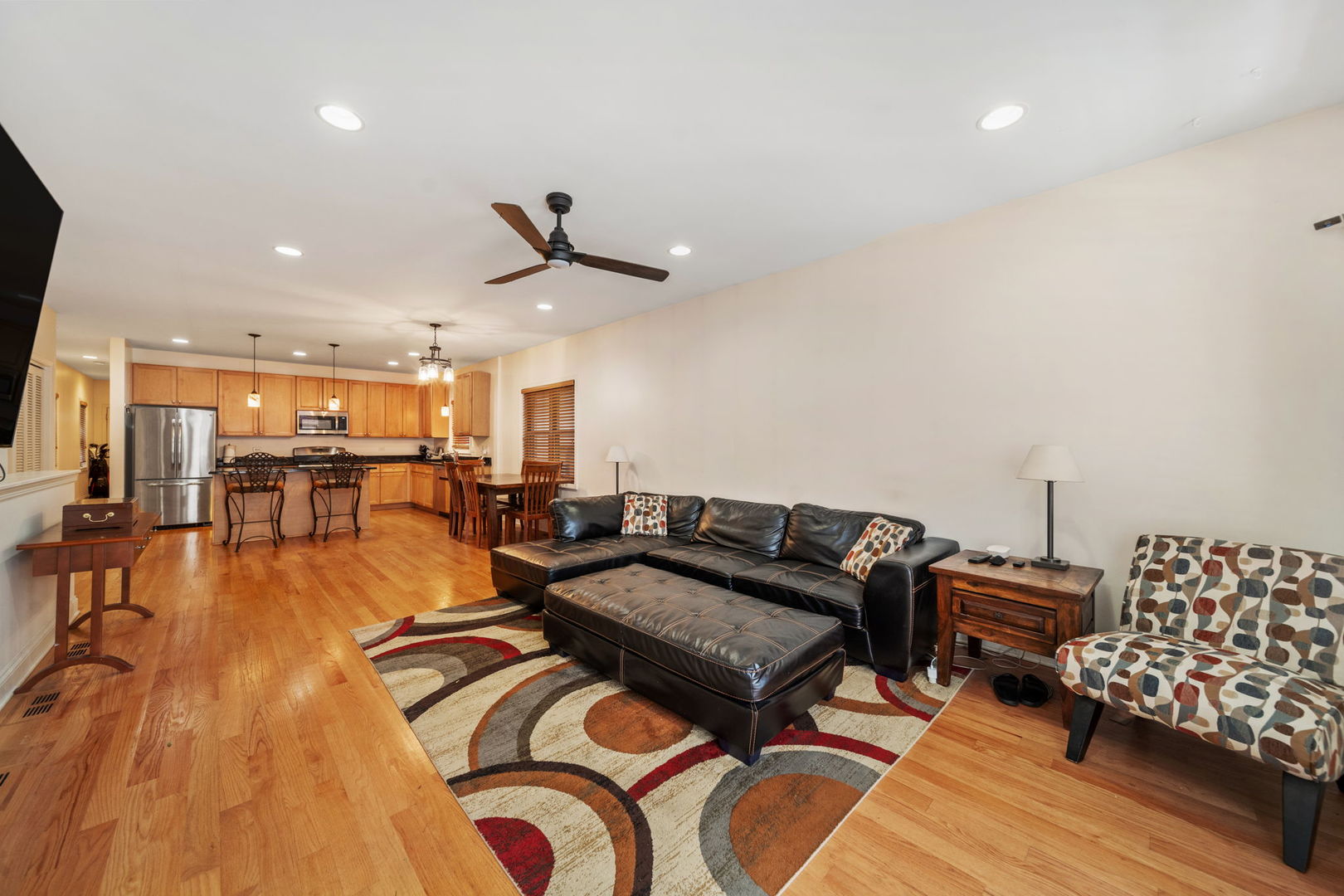 3213 South Wells Street, Unit 1 Chicago, IL 60616 - Photo 7 of 28 a living room with furniture and wooden floor