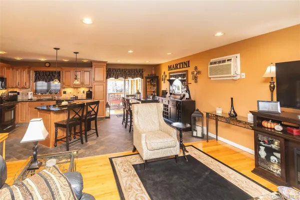 a living room with lots of furniture and a flat screen tv