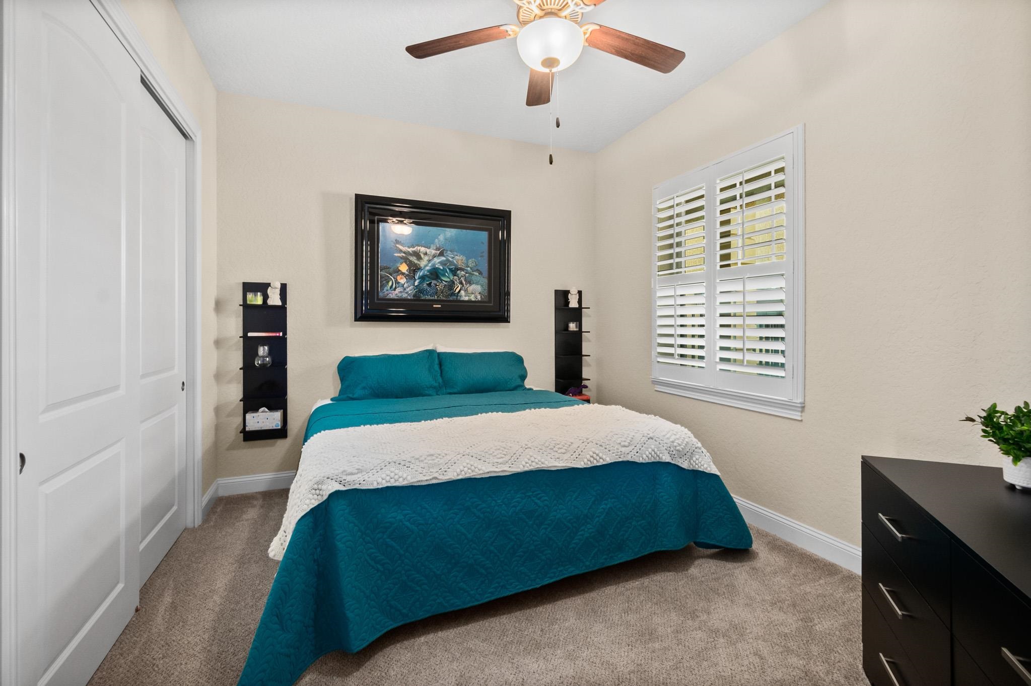 131 Laterra Links Circle, Unit 101 St. Augustine, FL 32092 - Photo 38 of 60 a bedroom with a large bed and a window