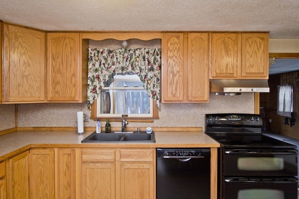191 Pine Acre Road Springfield, MA 01129 - Photo 8 of 35 a kitchen with a sink a stove and cabinets