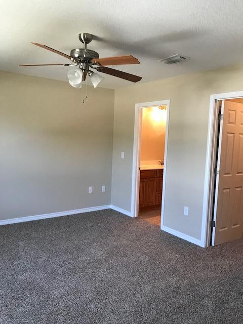6010 Medfords Way Crestview, FL 32539 - Photo 13 of 15 a view of a livingroom with a staircase