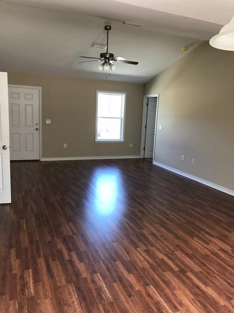 6010 Medfords Way Crestview, FL 32539 - Photo 8 of 15 wooden floor in an empty room with a window