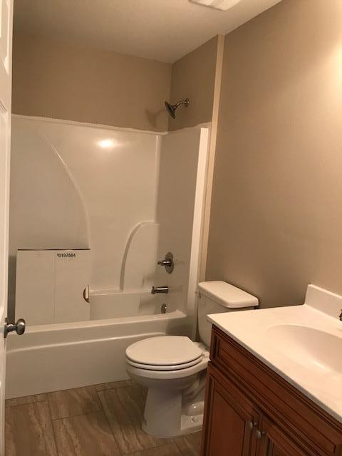 6010 Medfords Way Crestview, FL 32539 - Photo 10 of 15 a bathroom with a toilet a sink and shower