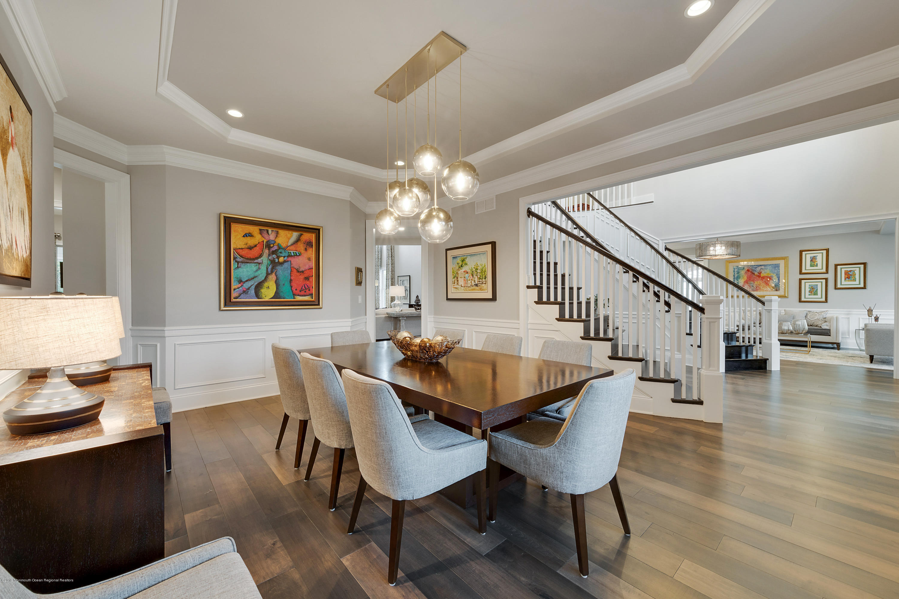 42 Windermere Road Lincroft, NJ 07738 - Photo 17 of 50 a dining room with furniture a chandelier and wooden floor