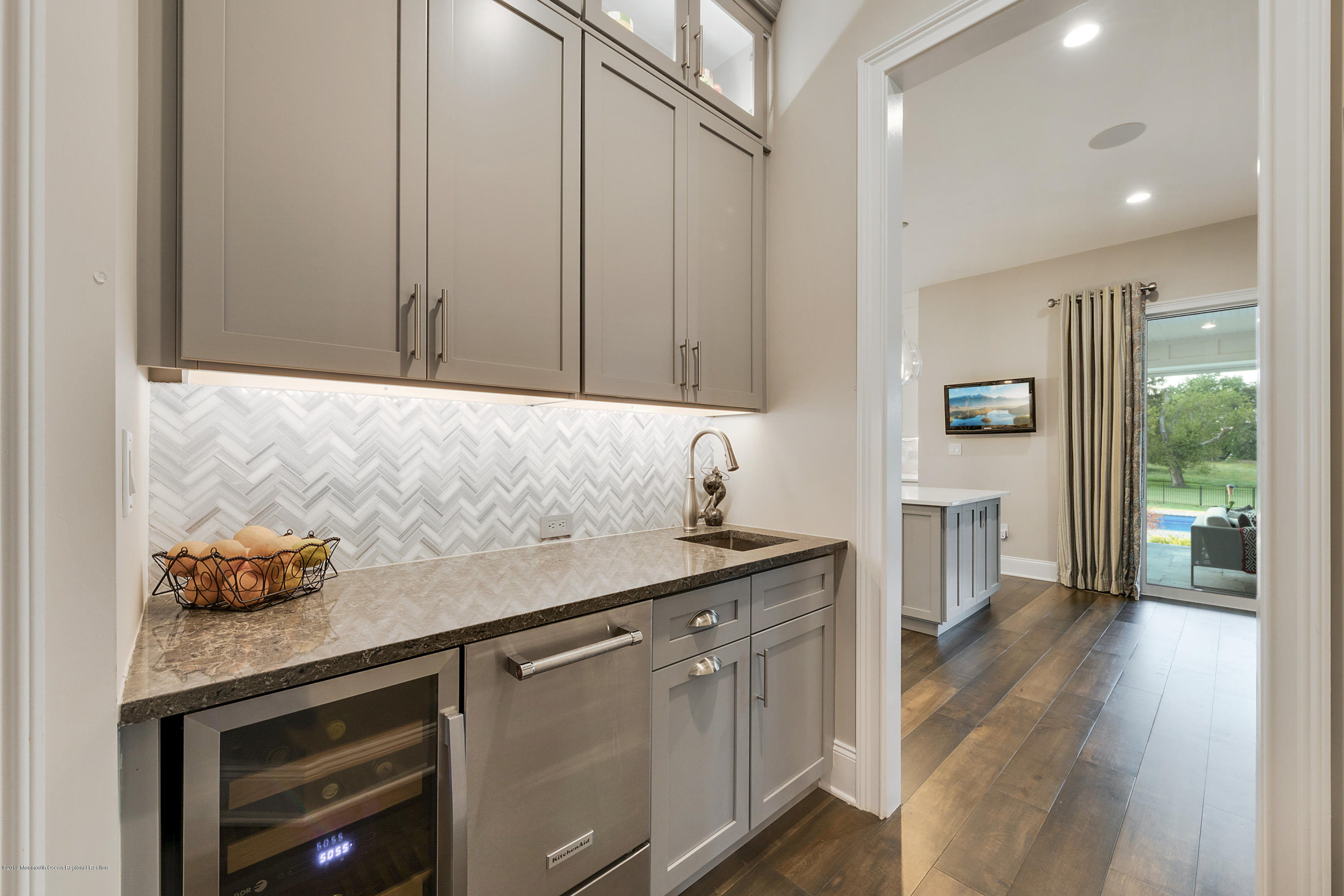 42 Windermere Road Lincroft, NJ 07738 - Photo 21 of 50 a kitchen with stainless steel appliances granite countertop a sink and a refrigerator