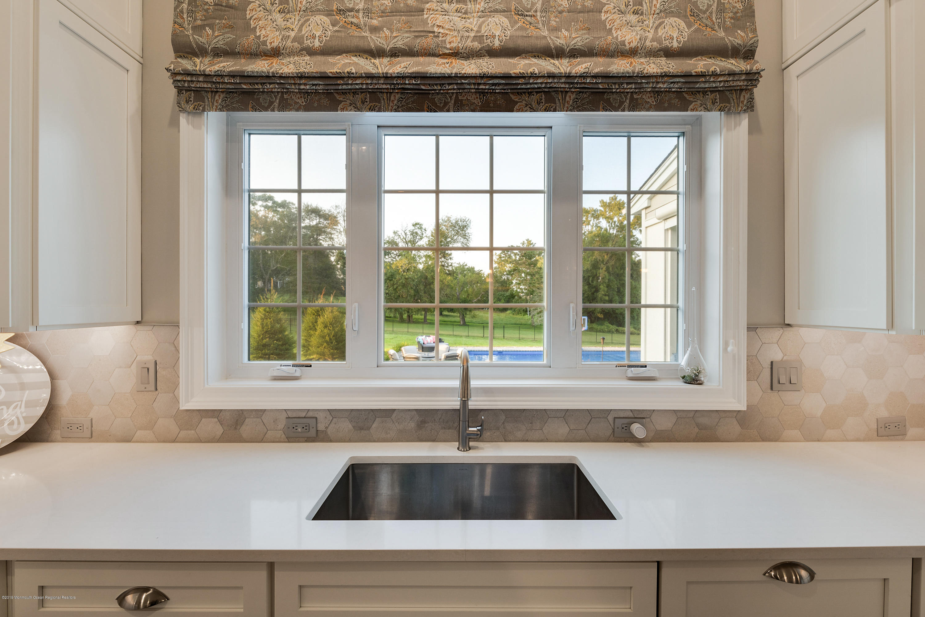 42 Windermere Road Lincroft, NJ 07738 - Photo 25 of 50 a view of a sink and a window