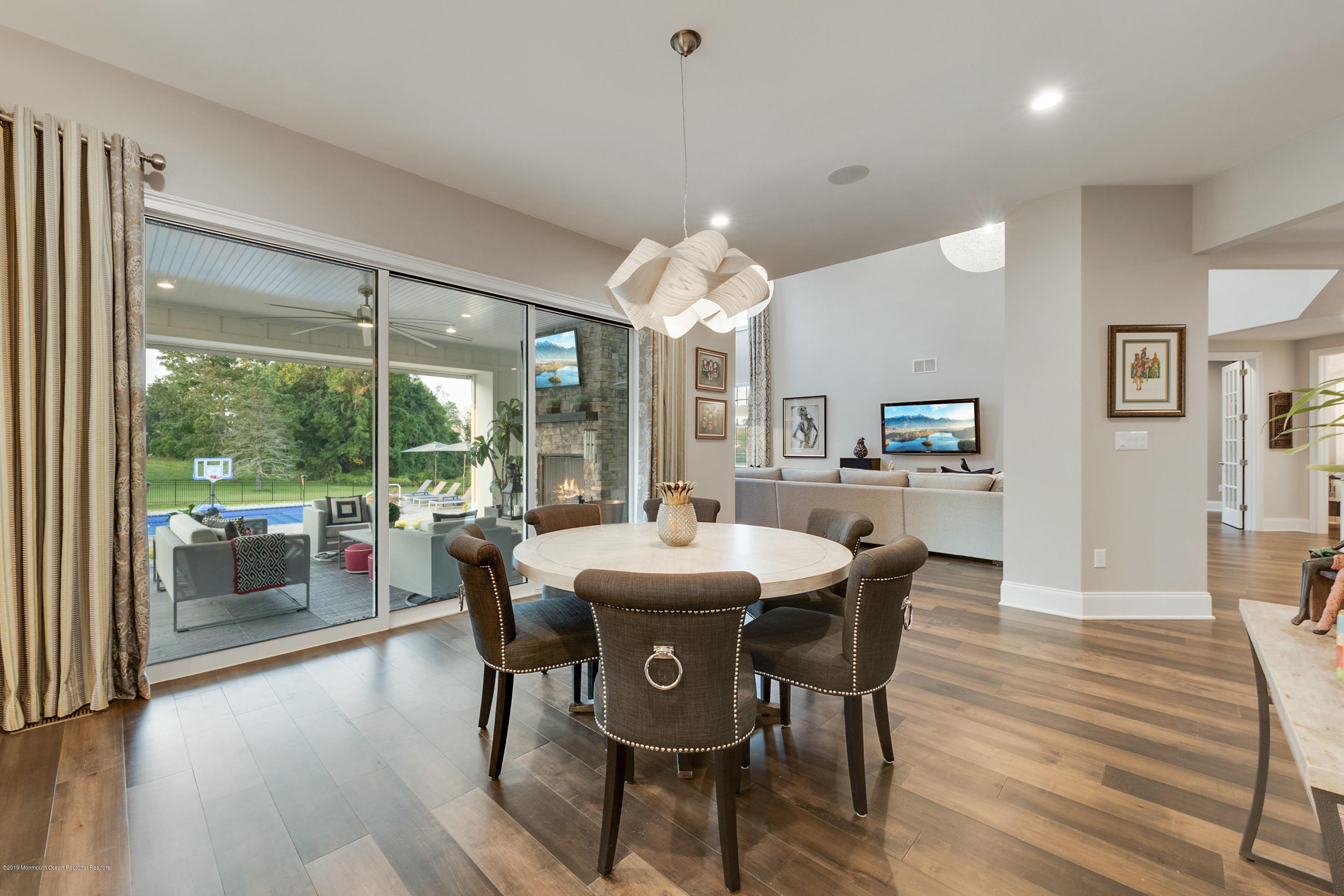 42 Windermere Road Lincroft, NJ 07738 - Photo 26 of 50 a view of a dining room with furniture window and wooden floor