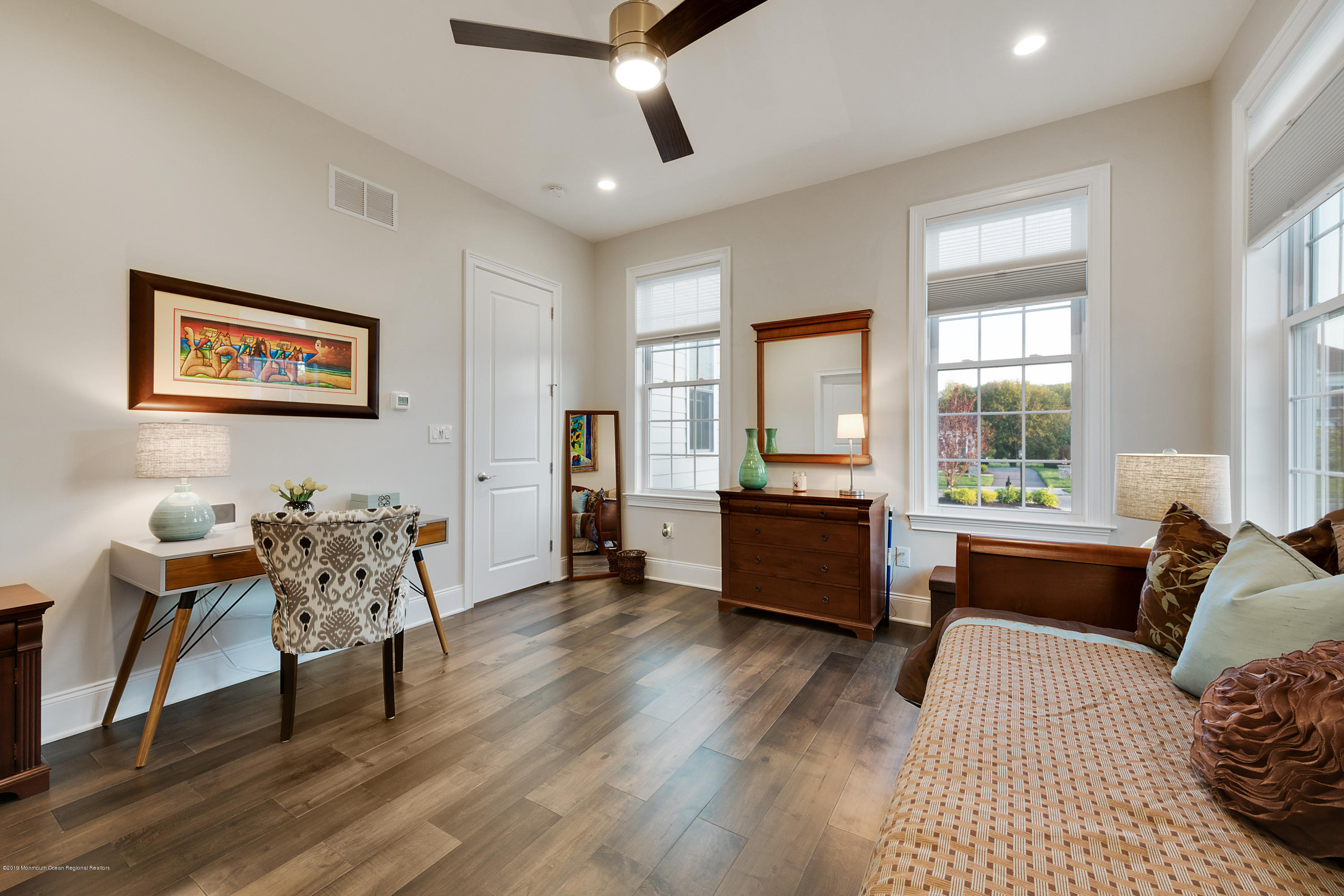 42 Windermere Road Lincroft, NJ 07738 - Photo 28 of 50 a bedroom with a bed and wooden floor