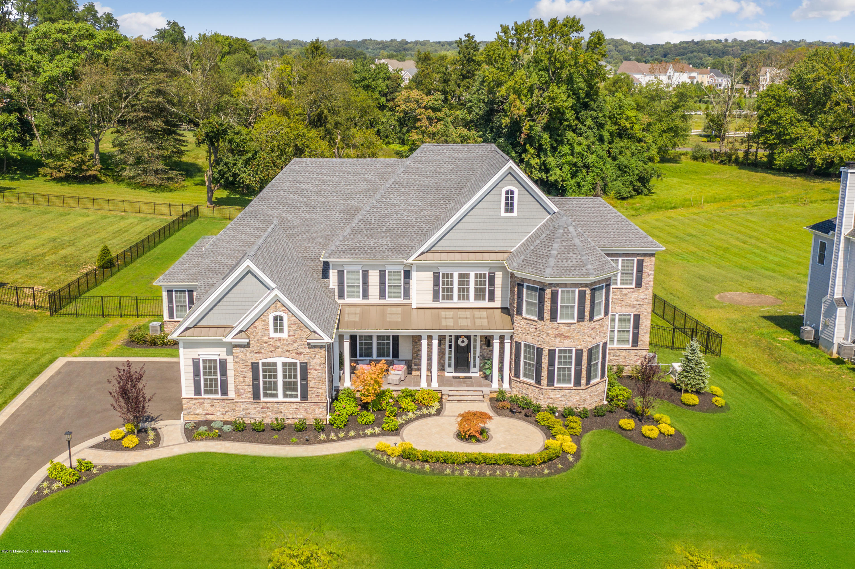42 Windermere Road Lincroft, NJ 07738 - Photo 4 of 50 a aerial view of a house with a garden and plants