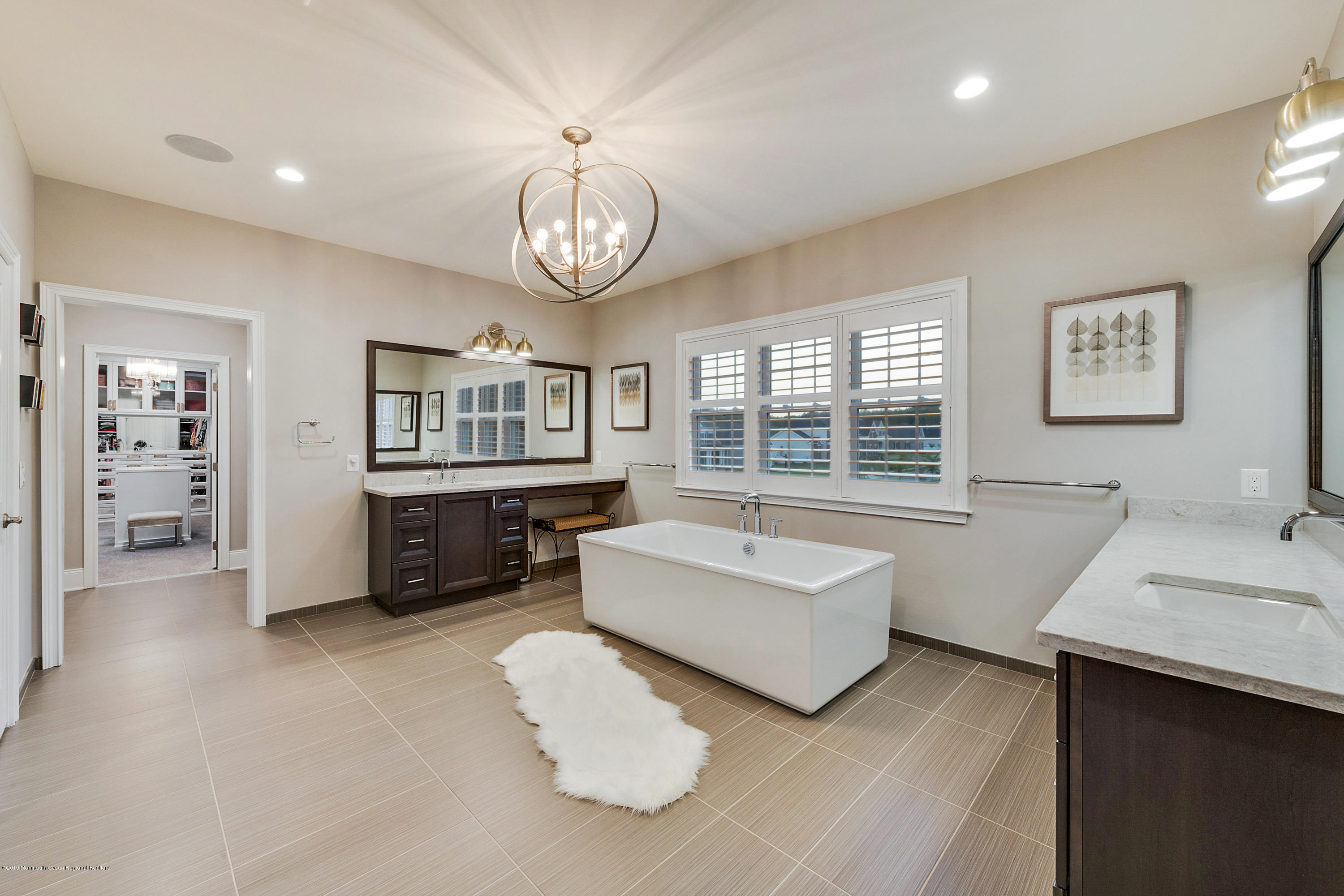 42 Windermere Road Lincroft, NJ 07738 - Photo 32 of 50 a spacious bedroom with a bed and a large window