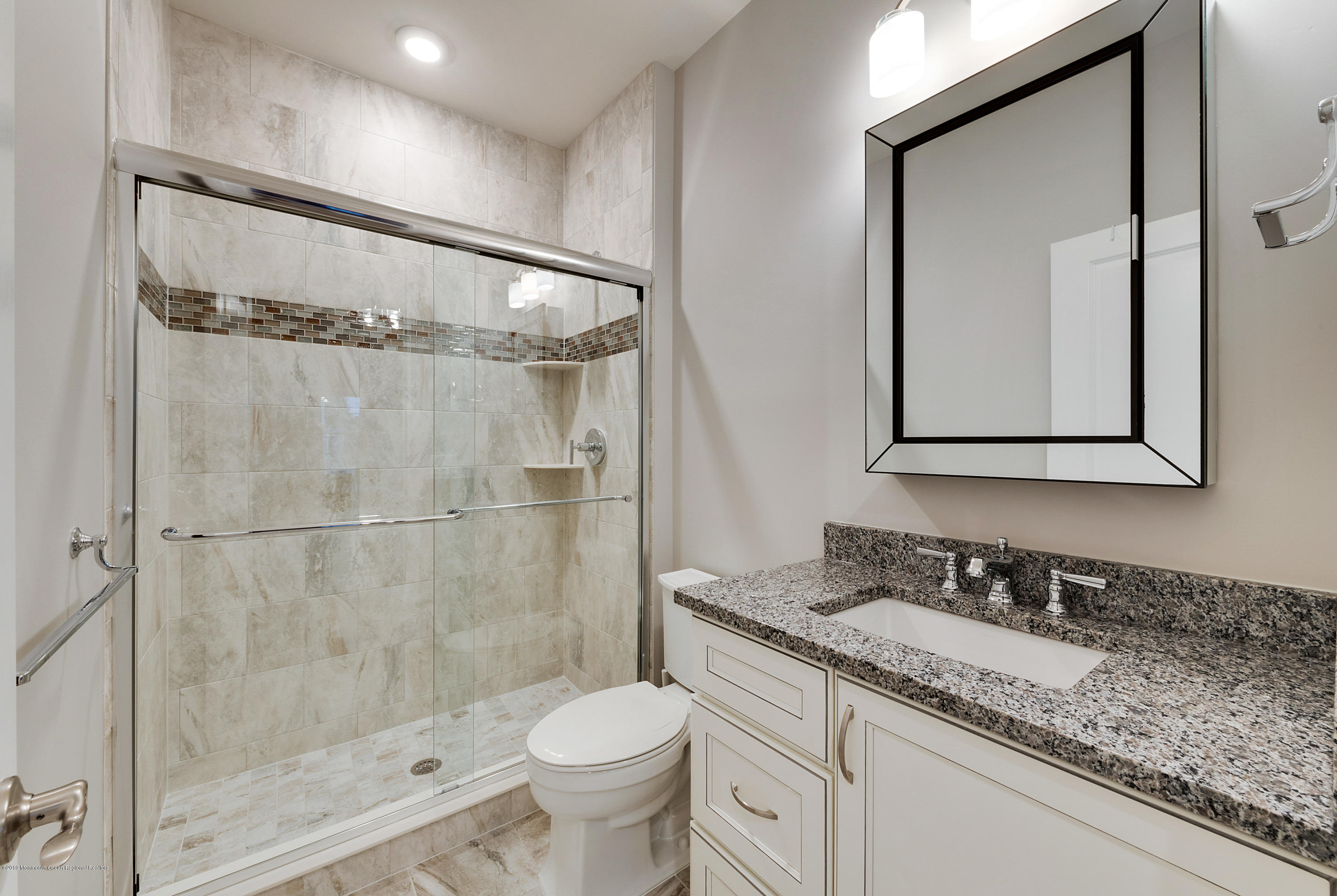 42 Windermere Road Lincroft, NJ 07738 - Photo 38 of 50 a bathroom with a granite countertop sink mirror vanity and toilet