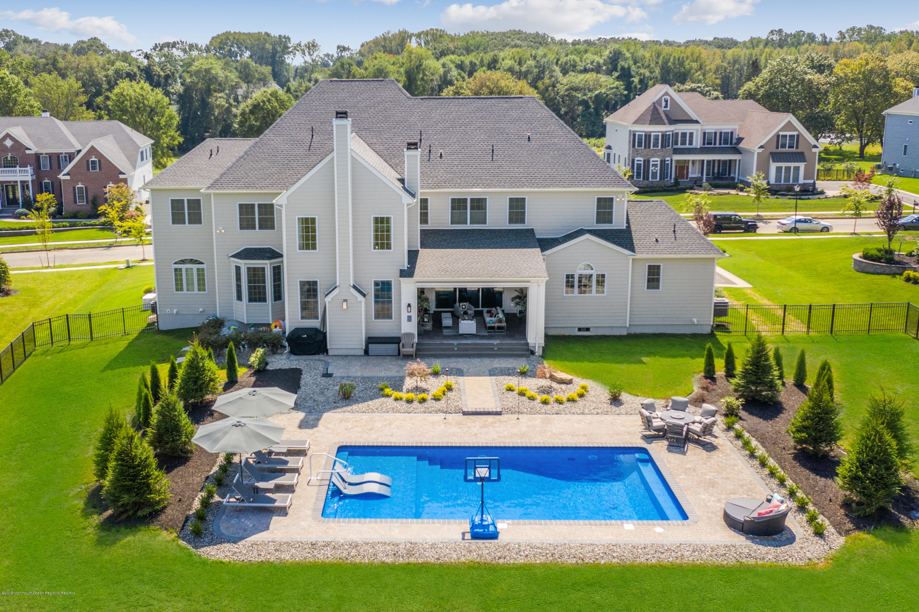 42 Windermere Road Lincroft, NJ 07738 - Photo 5 of 50 a view of a house with swimming pool yard and outdoor seating