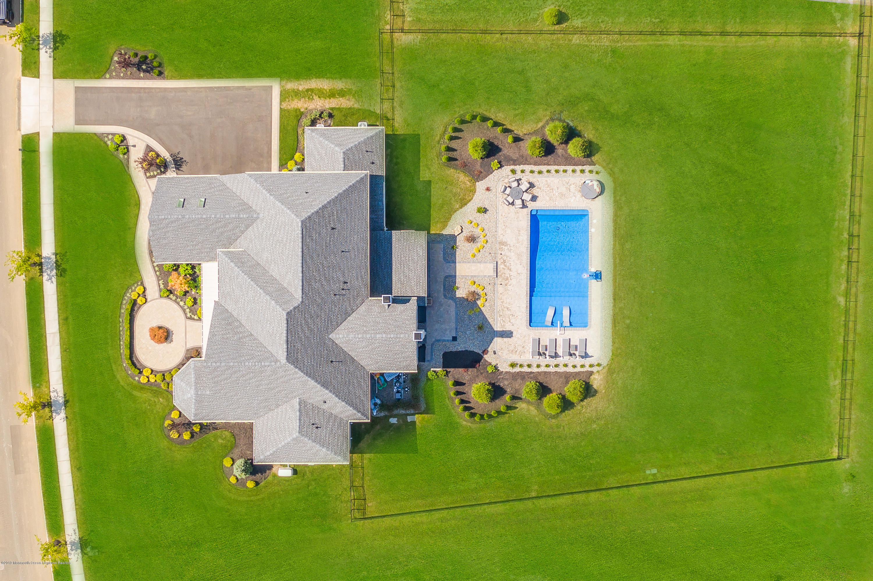 42 Windermere Road Lincroft, NJ 07738 - Photo 6 of 50 an aerial view of a house with swimming pool patio and outdoor seating