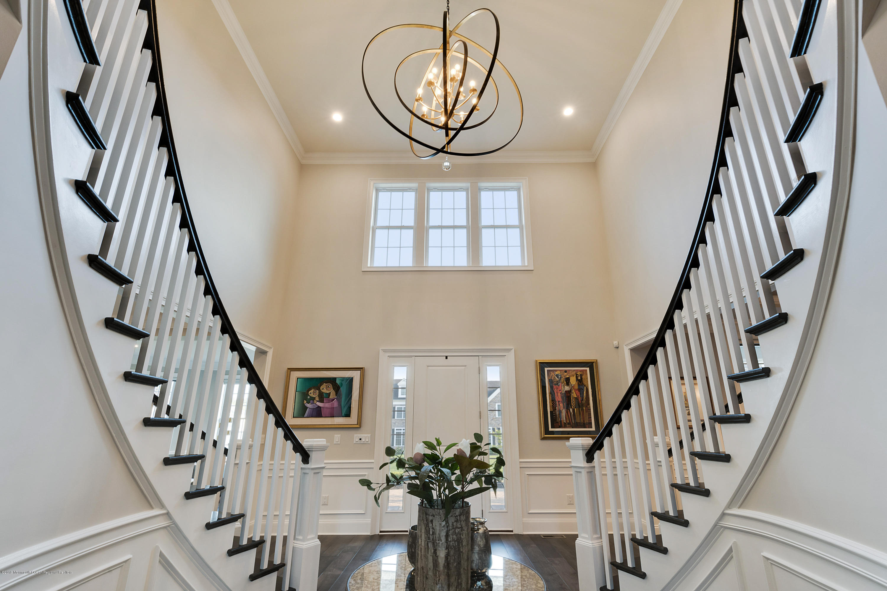 42 Windermere Road Lincroft, NJ 07738 - Photo 10 of 50 a view of staircase with wooden floor and a chandelier