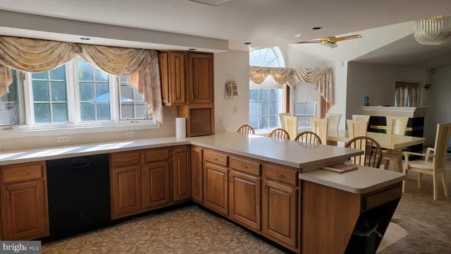a spacious bathroom with a sink double vanity and a mirror
