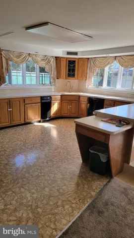 a living room with a couch and a large window