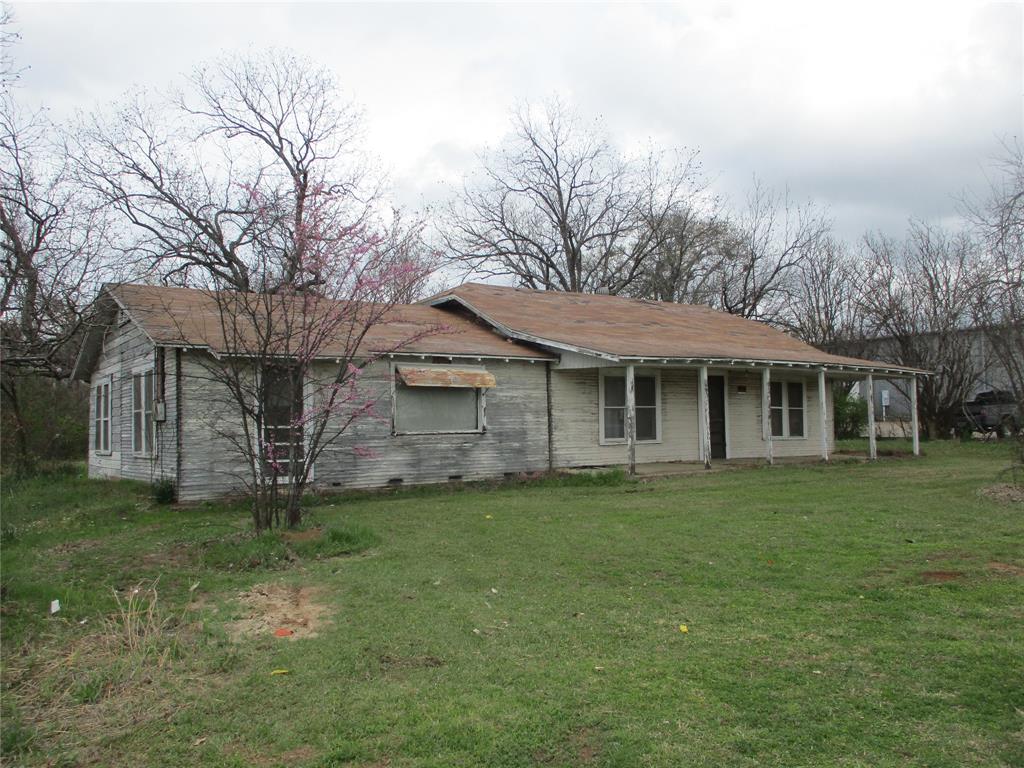 522 Quitman Street Emory, TX 75440 - Photo 1 of 6 a front view of a house with a garden