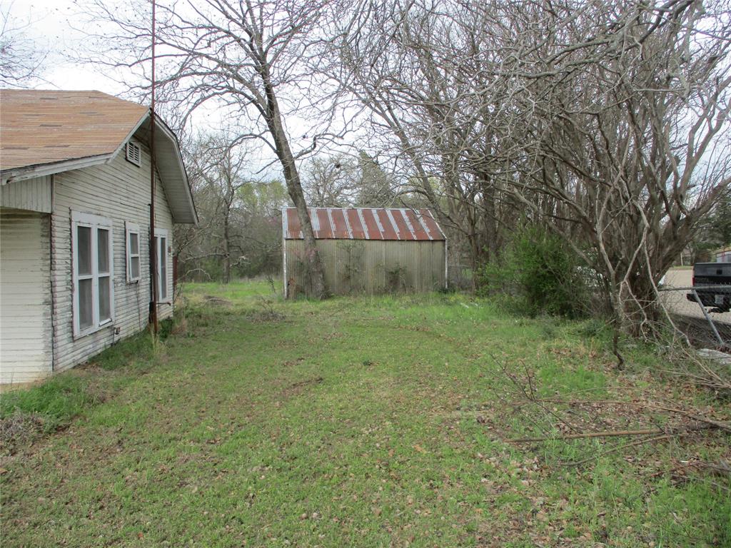 522 Quitman Street Emory, TX 75440 - Photo 6 of 6 a backyard of a house with lots of green space