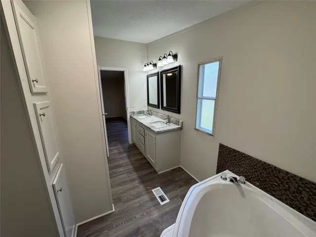 a view of a hallway with washer and dryer