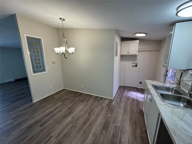 a view of a kitchen from the dinning room