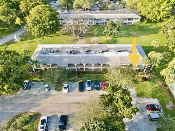 a kitchen with a sink a stove and white cabinets