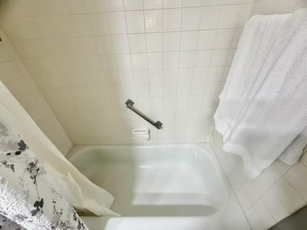 a view of a swimming pool with a yard