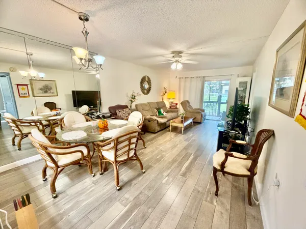 a view of a trees in front of a building with a garden