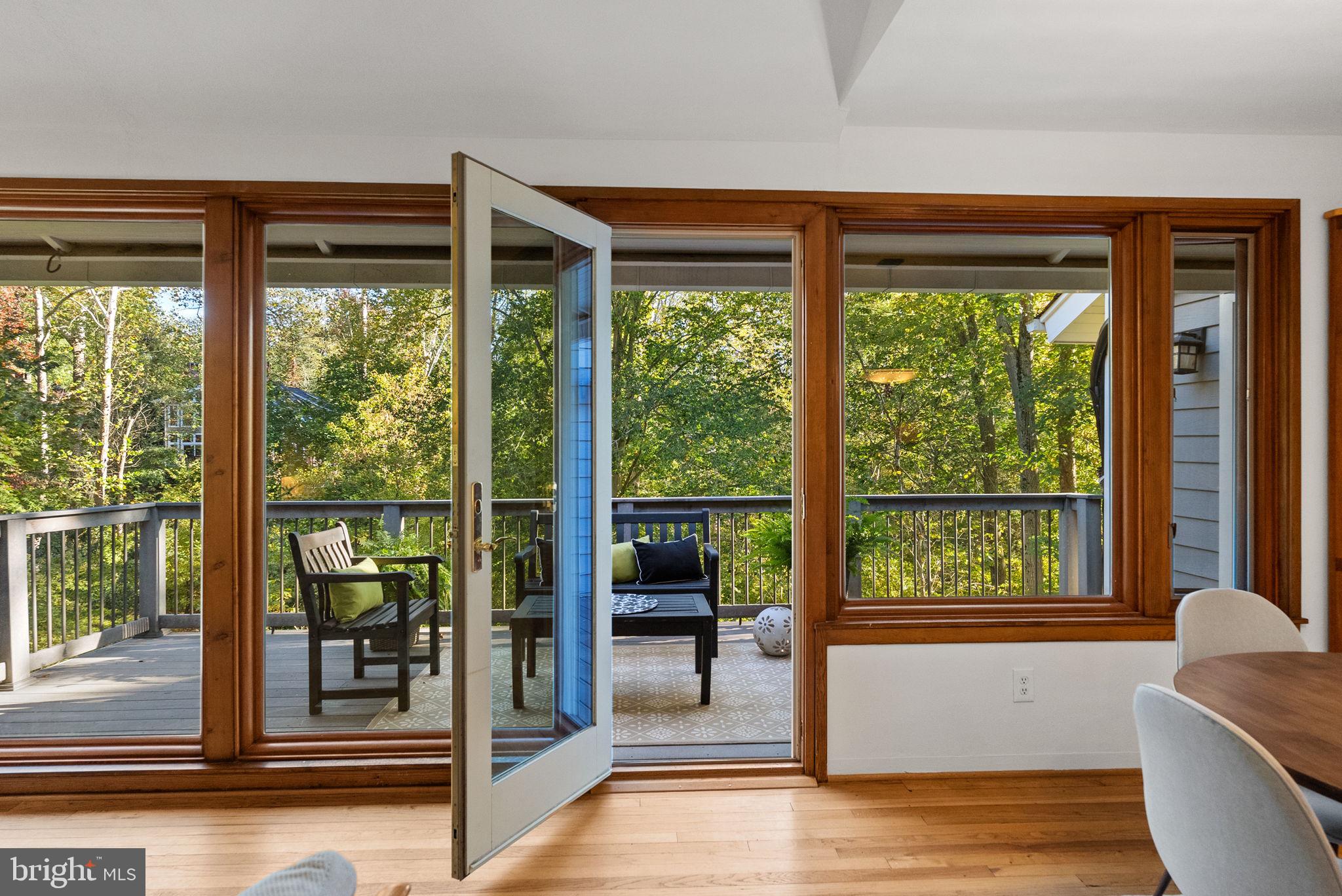 7111 Braeburn Place Bethesda, MD 20817 - Photo 15 of 86 a view of a living room and floor to ceiling window