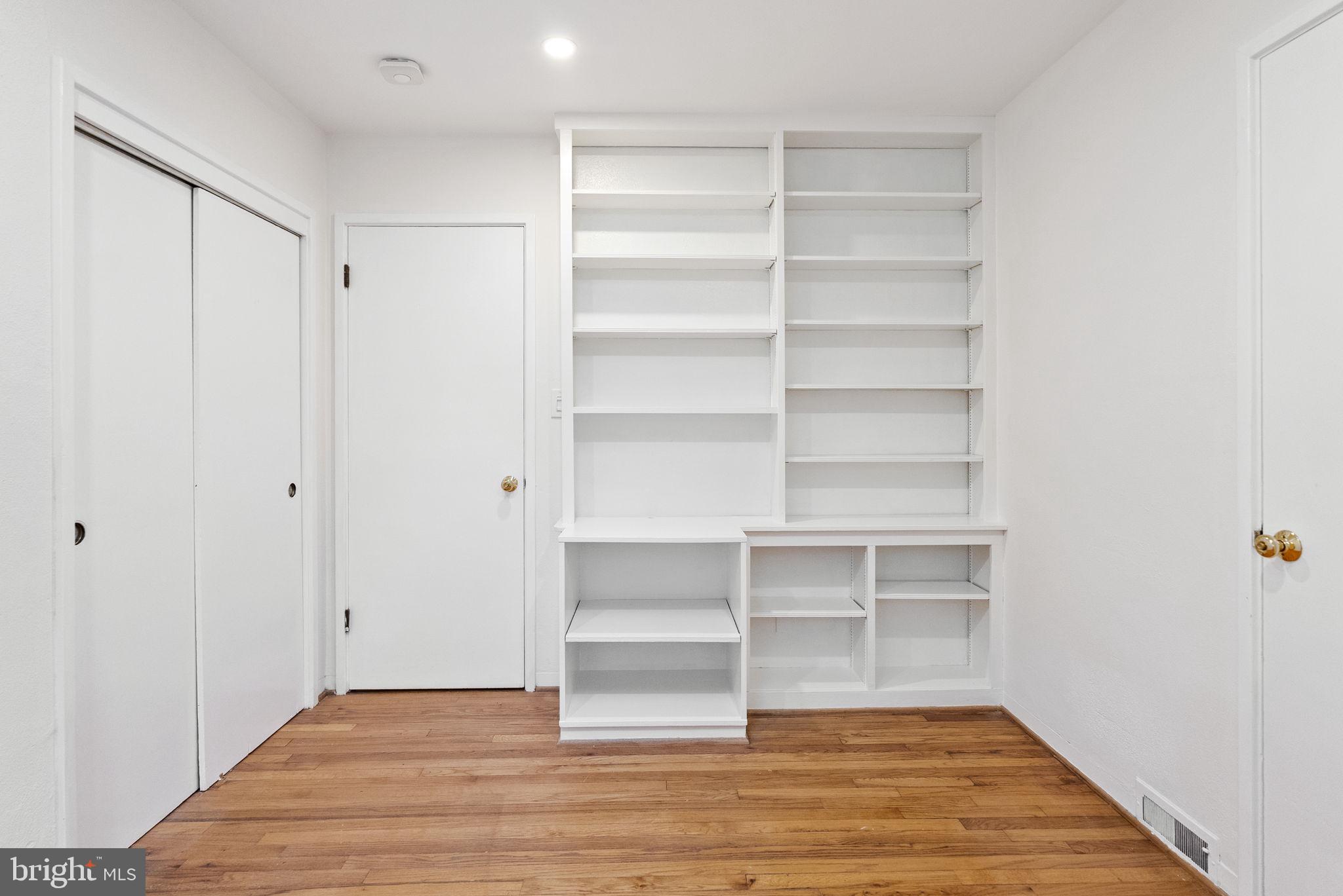 7111 Braeburn Place Bethesda, MD 20817 - Photo 36 of 86 a view of an empty room with empty racks