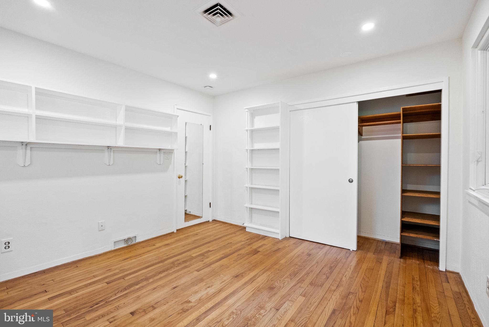 7111 Braeburn Place Bethesda, MD 20817 - Photo 38 of 86 a view of empty room with wooden floor and closet