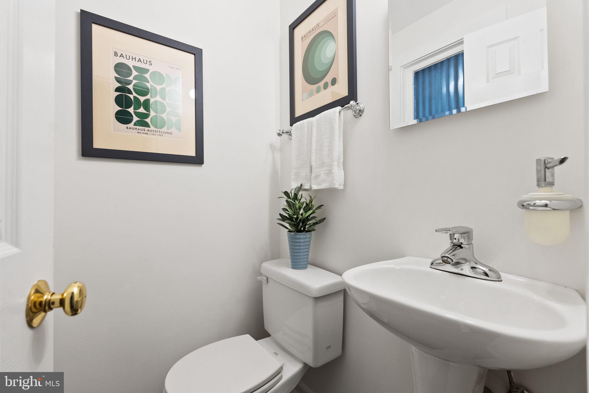 7111 Braeburn Place Bethesda, MD 20817 - Photo 44 of 86 a bathroom with a toilet a sink and mirror