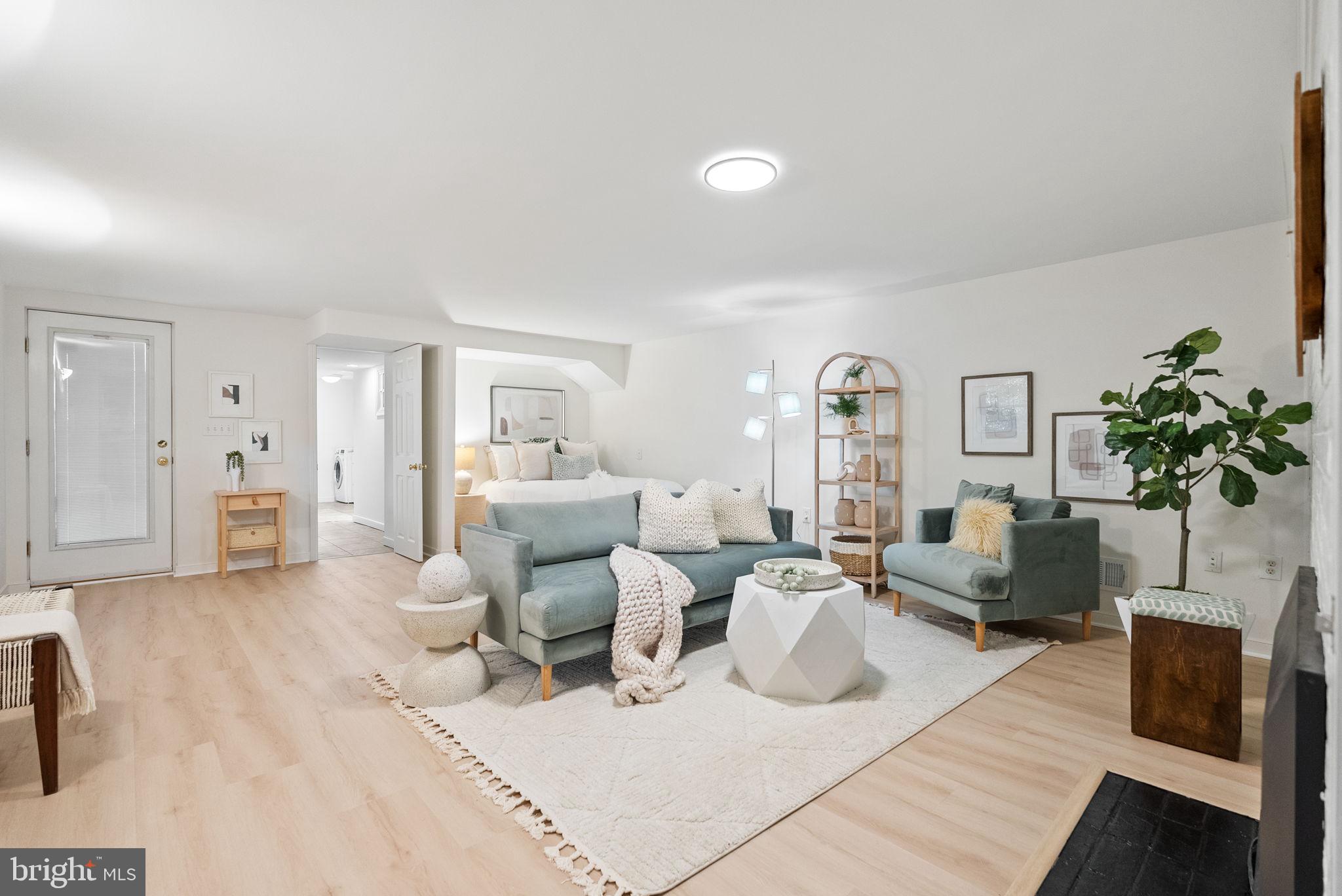 7111 Braeburn Place Bethesda, MD 20817 - Photo 46 of 86 a living room with furniture and a potted plant