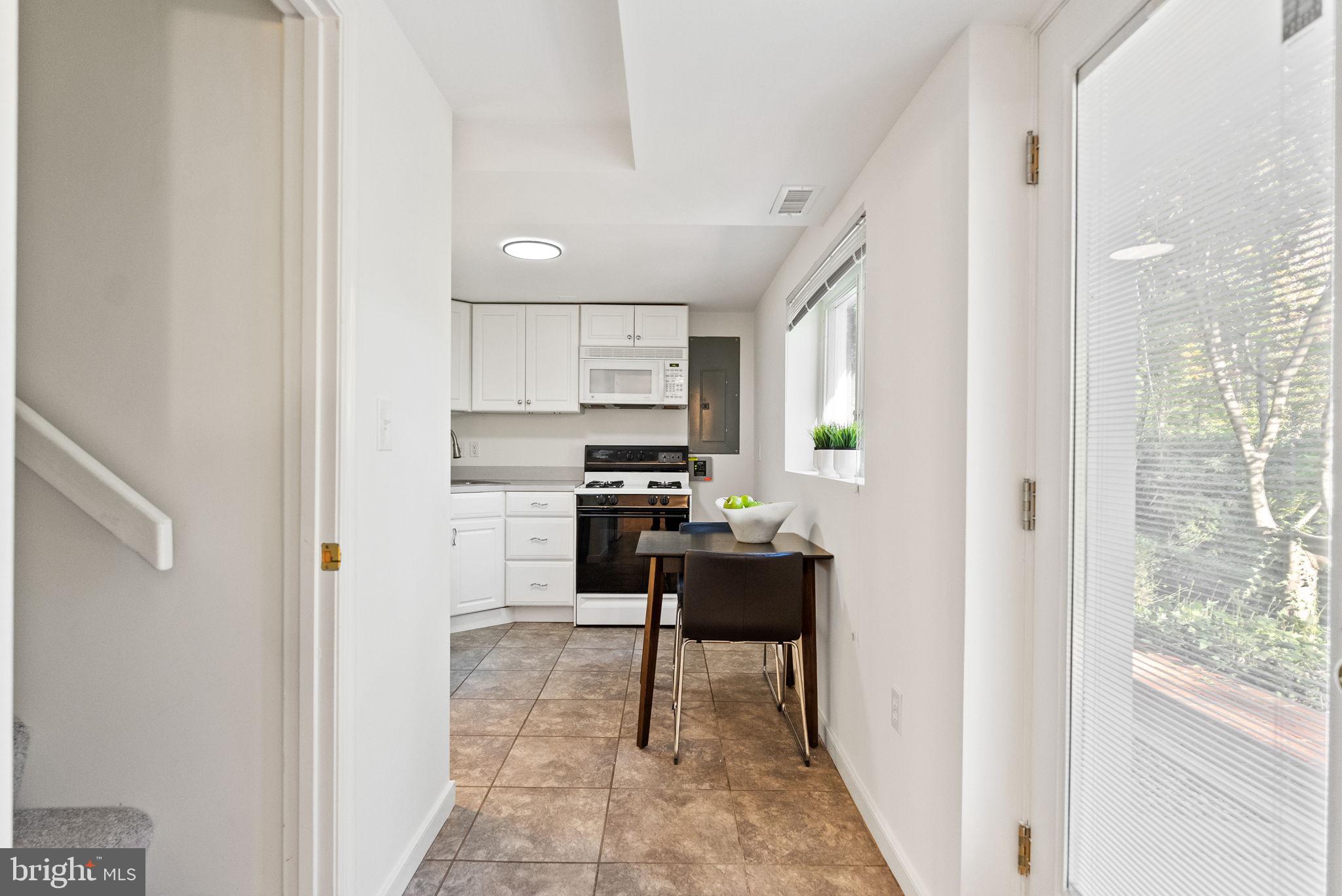 7111 Braeburn Place Bethesda, MD 20817 - Photo 50 of 86 a open kitchen with stainless steel appliances granite countertop a refrigerator and a stove top oven