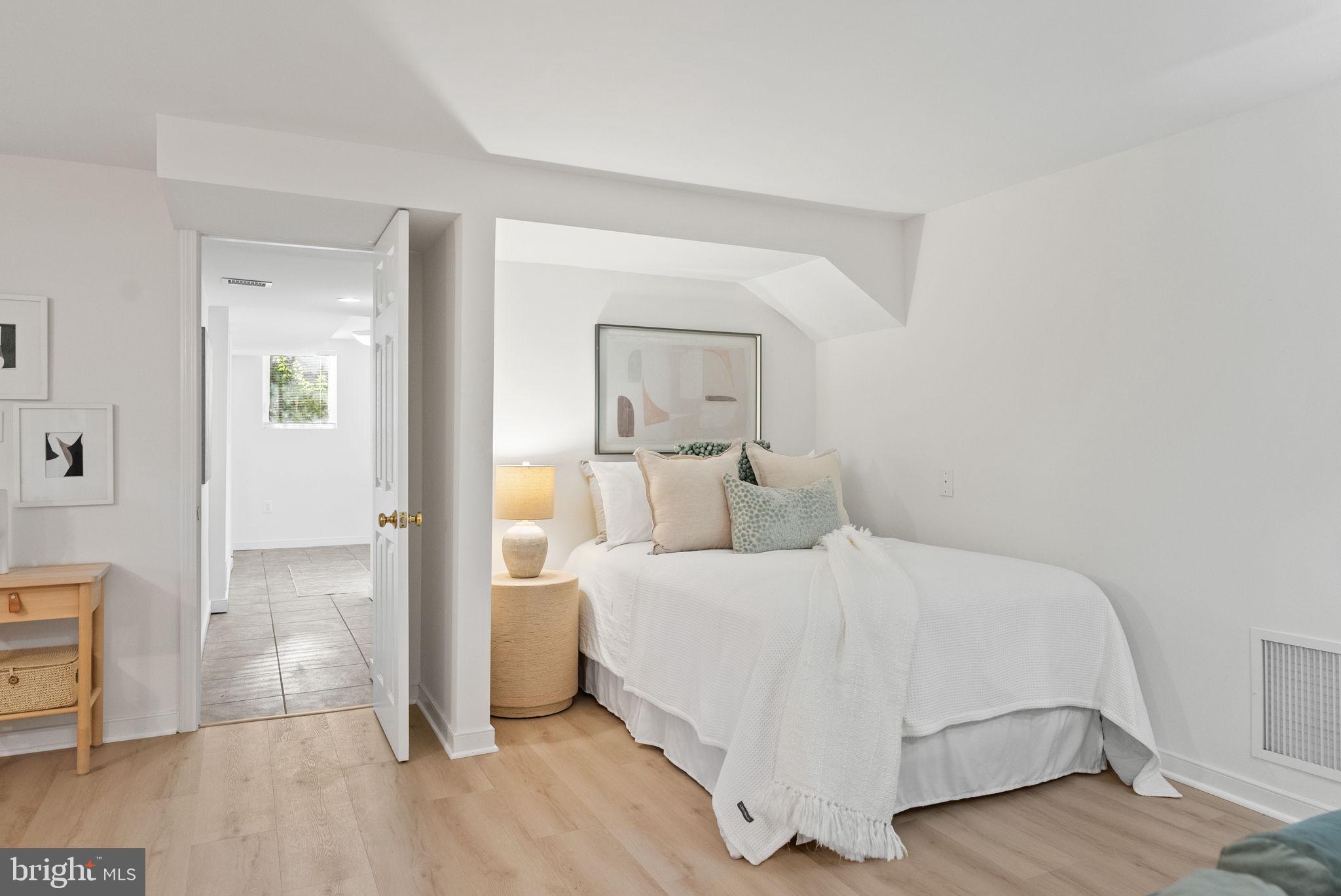 7111 Braeburn Place Bethesda, MD 20817 - Photo 53 of 86 a bedroom with a bed and a mirror