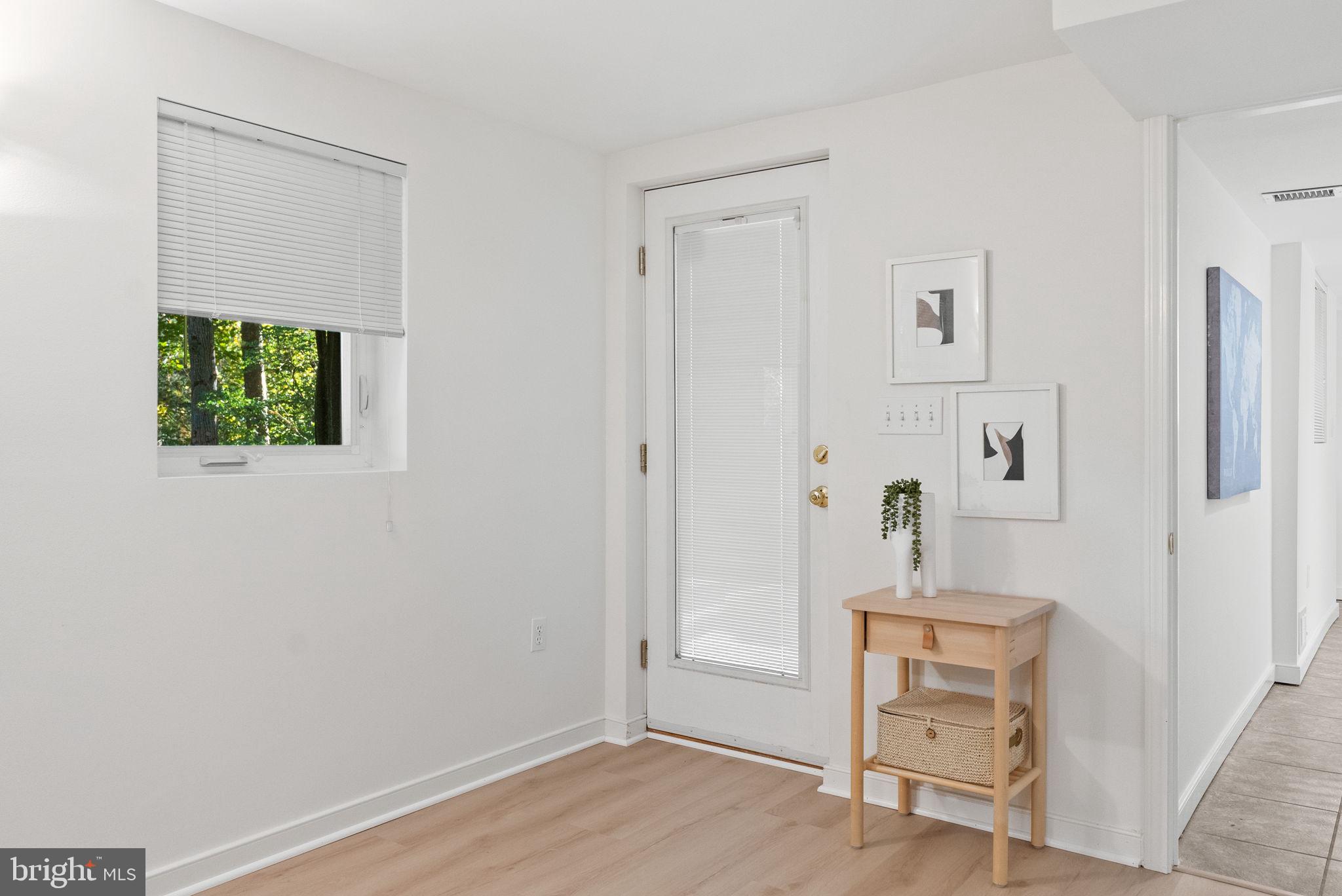 7111 Braeburn Place Bethesda, MD 20817 - Photo 54 of 86 a view of a livingroom with wooden floor and a window