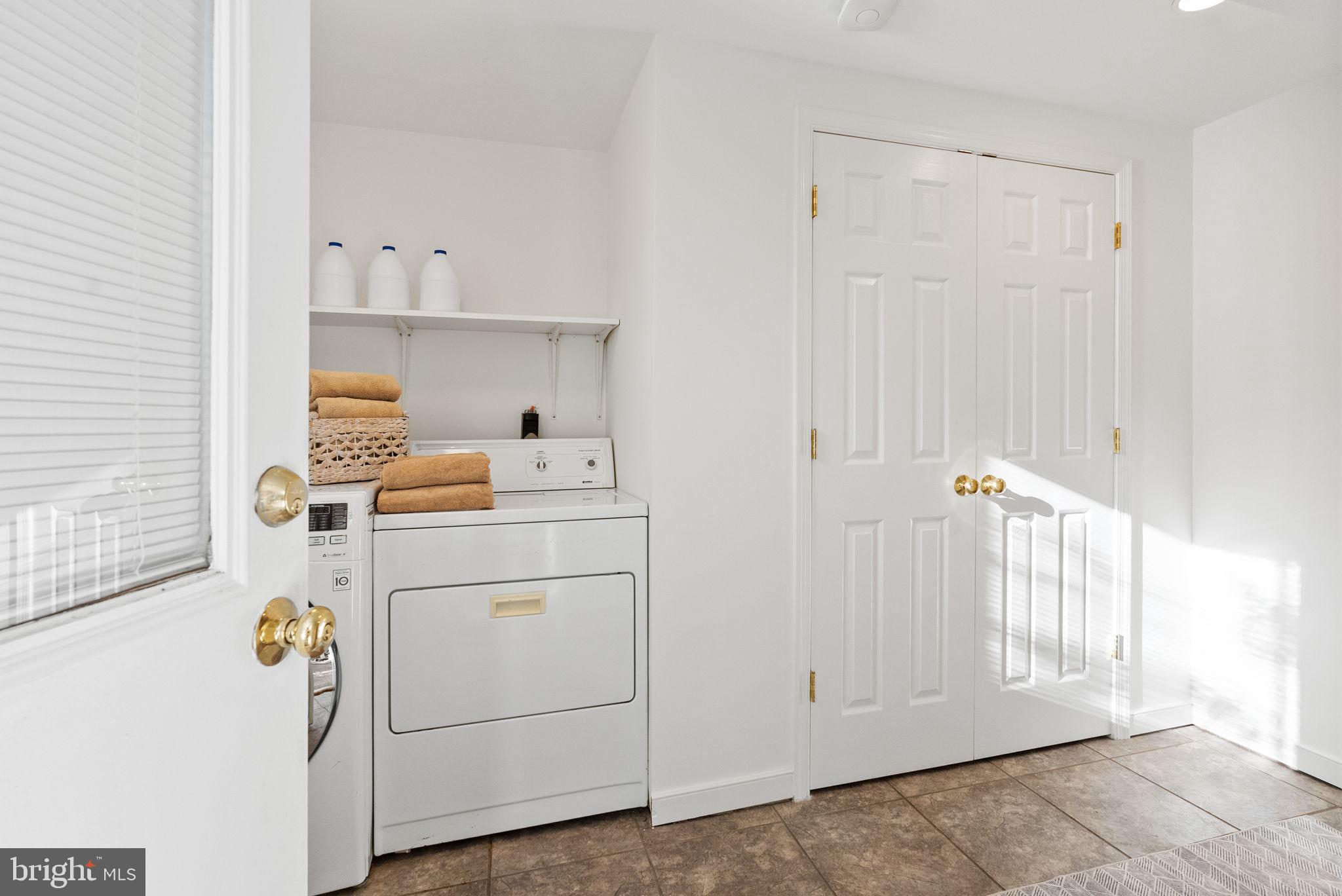 7111 Braeburn Place Bethesda, MD 20817 - Photo 56 of 86 a view of storage and utility room with washer and dryer
