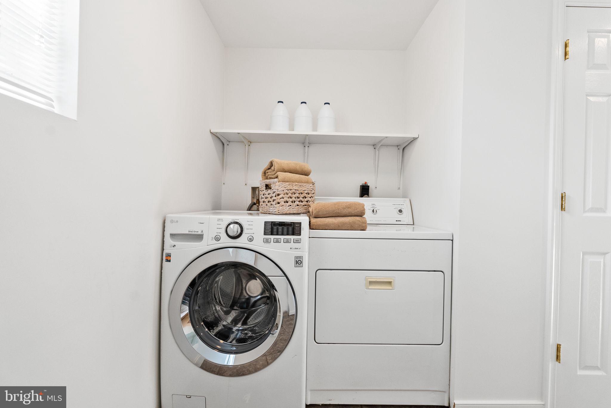 7111 Braeburn Place Bethesda, MD 20817 - Photo 58 of 86 a utility room with dryer and washer