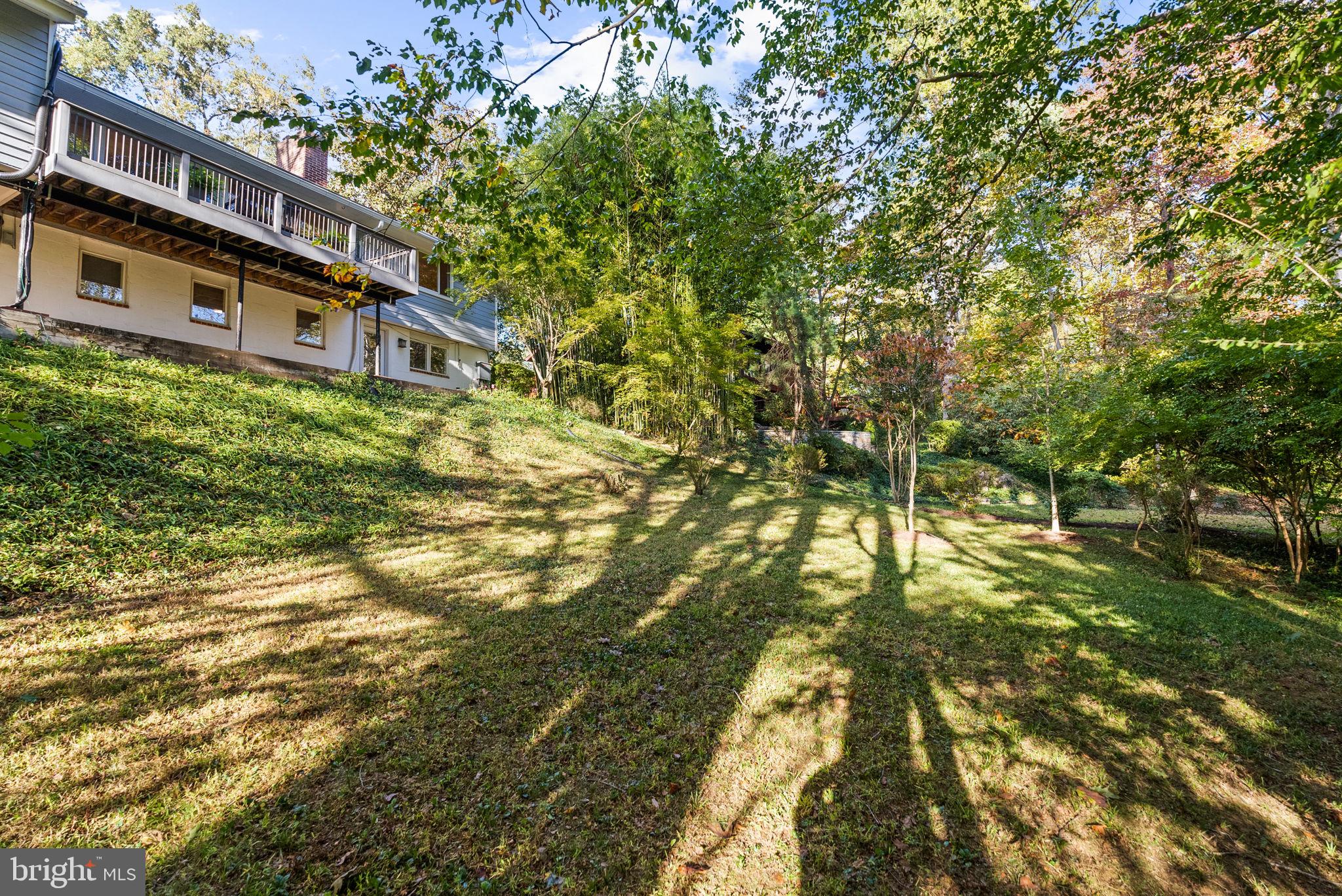 7111 Braeburn Place Bethesda, MD 20817 - Photo 70 of 86 a yellow building in the middle of a yard