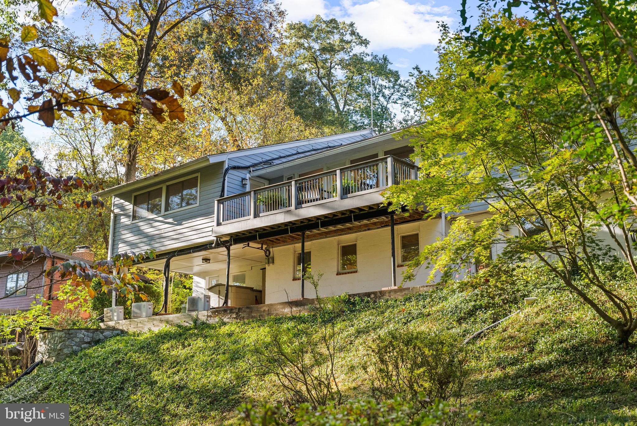 7111 Braeburn Place Bethesda, MD 20817 - Photo 71 of 86 front view of a house with a tree