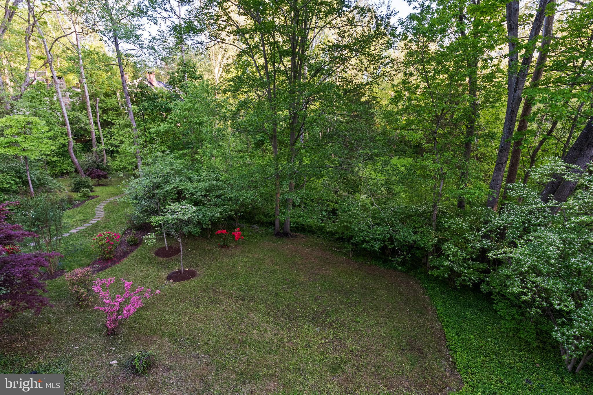 7111 Braeburn Place Bethesda, MD 20817 - Photo 76 of 86 a backyard of a house with lots of green space