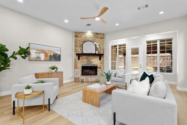 a kitchen with stainless steel appliances granite countertop a sink refrigerator and cabinets