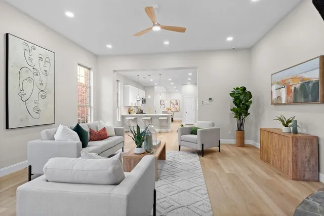 a living room with furniture and windows