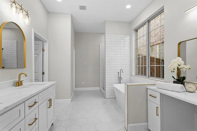 a bedroom with a bed and a potted plant