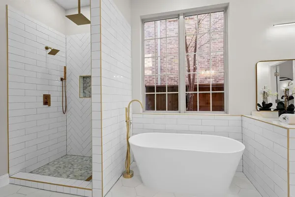 a bedroom with a bed and a potted plant