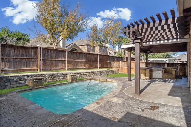 a view of a backyard with a sitting area and tub