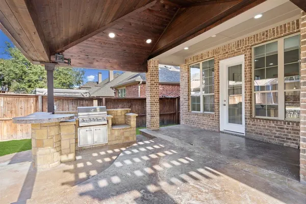 a view of a backyard with a sitting area and tub
