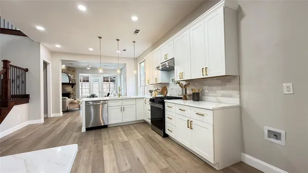 a view of a porch with furniture and garden