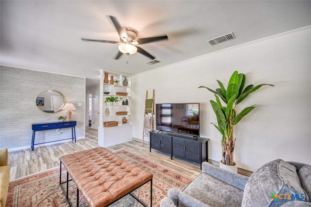 644 Cypress Ridge Road McQueeney, TX 78123 - Photo 14 of 45 a living room with furniture a piano and a flat screen tv