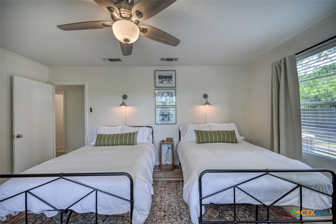 644 Cypress Ridge Road McQueeney, TX 78123 - Photo 26 of 45 a bedroom with a bed and window