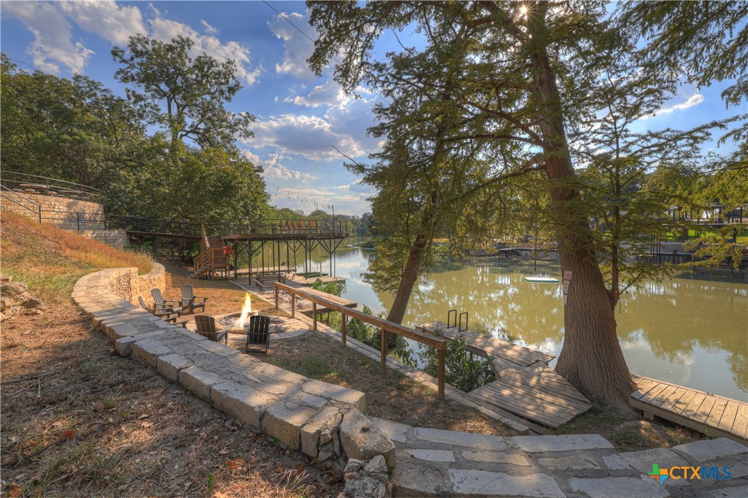 644 Cypress Ridge Road McQueeney, TX 78123 - Photo 35 of 45 a view of a lake from a yard